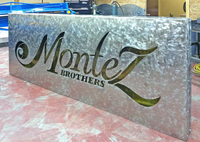 Montez Brothers sign by Paul Silva